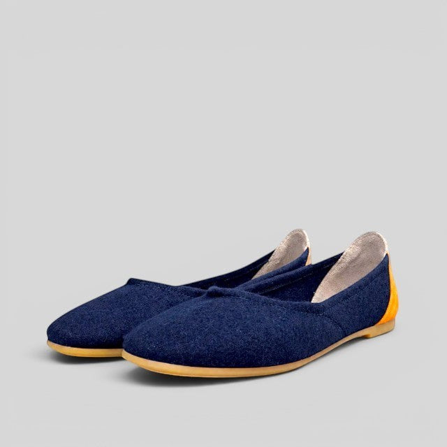 Baabuk blue wool ballerina flats with a contrasting yellow heel detail and durable rubber sole.