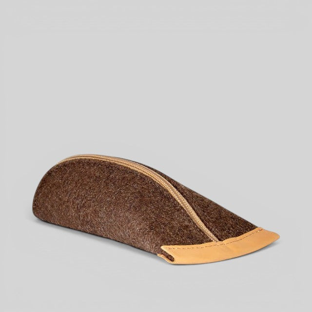 Baabuk brown wool pencil case with genuine leather accents and a zippered closure on a neutral background.