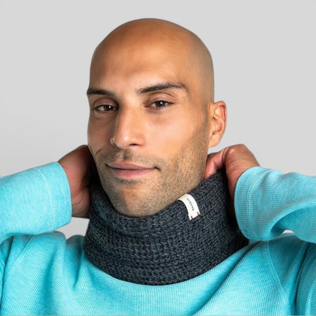 Baabuk dark grey baby alpaca wool infinity scarf worn by a man in a light blue thermal shirt