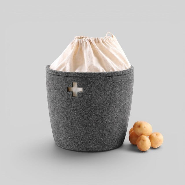 Baabuk small dark grey felted wool basket with a Swiss cross cutout and cream fabric drawstring liner.