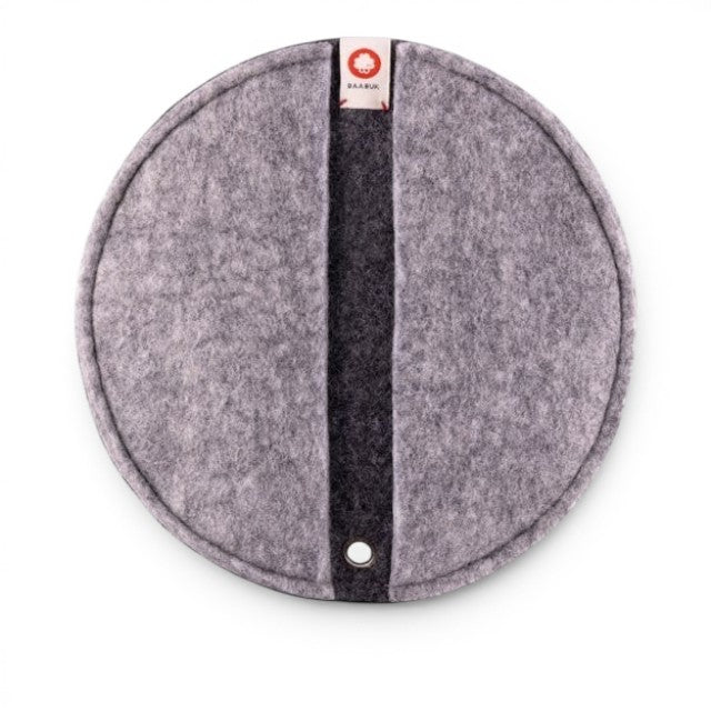 Baabuk dark grey round felted wool potholder with a leather strap and hanging eyelet for kitchen use.