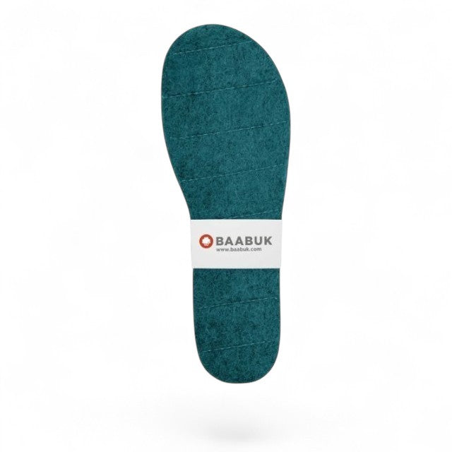 Baabuk emerald green handcrafted felt slipper insoles with white branded paper band on a white background
