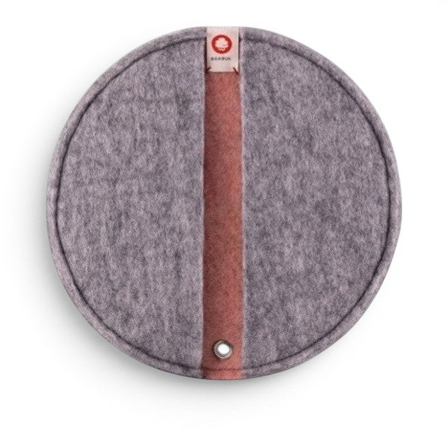 Baabuk round felted wool potholder in grey with a pink center stripe and leather hanging loop