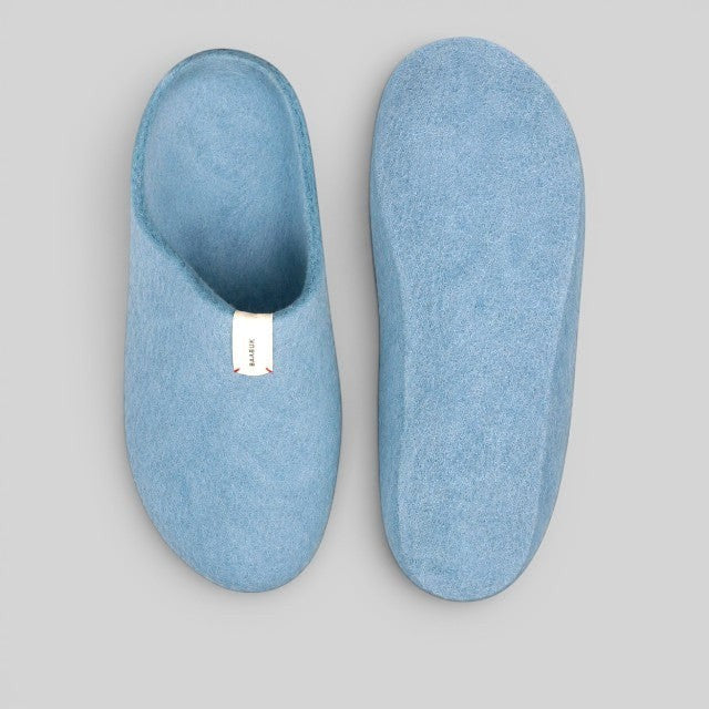 Baabuk Kanga light blue handmade wool slippers with a simple slip-on design and branded tab
