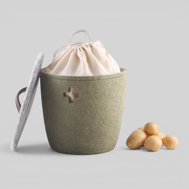 Baabuk khaki felted wool basket with lid and fabric liner, featuring a Swiss cross cutout and leather handle.