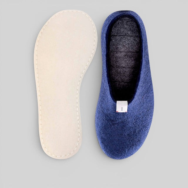 Baabuk Mel navy blue handmade wool slippers with natural crepe rubber sole on a grey background