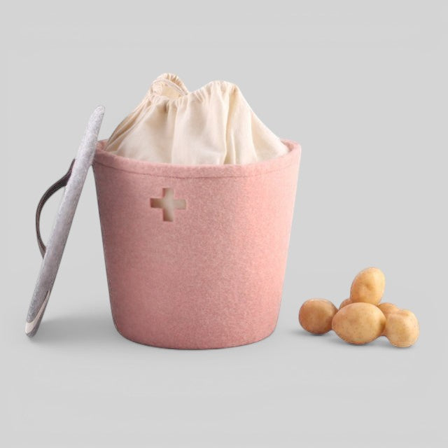 Baabuk small pink felted wool storage basket with a Swiss cross cutout and a leather handle lid
