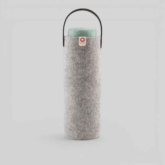 Baabuk light grey wool wine cooler with a leather carrying strap, designed for eco-friendly bottle insulation.